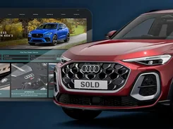 Promotional composition showing a car dealer website on a large display behind a red Audi SUV with a SOLD plate.