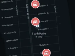 Mobile rider-app map of South Padre Island with available car markers and a “Scan to Ride” button.