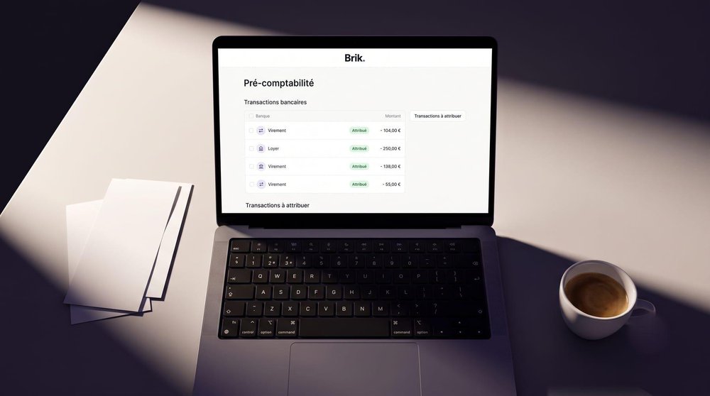 Brik pre-accounting screen on a laptop listing bank transactions and their assignment status.