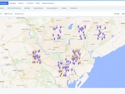 Carelo Care Map screen showing a map around Cardiff with many color-coded location pins and a legend for carers, service users, and visits in progress.