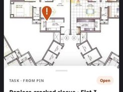 Mobile floor-plan view with an orange issue pin and an open task card for replacing a cracked sleeve in a flat kitchen.