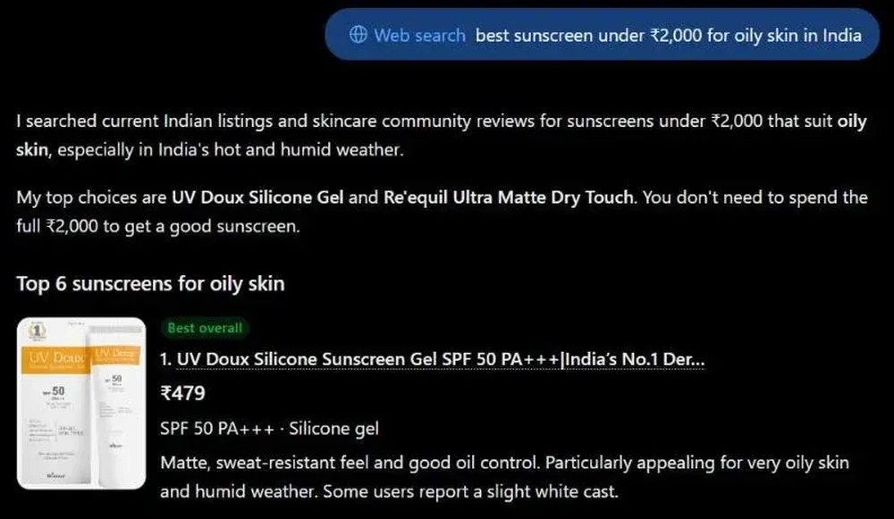 Dark-mode AI answer screen showing a web-search query for sunscreen under ₹2,000 for oily skin in India and a ranked result for UV Doux Silicone Sunscreen Gel.