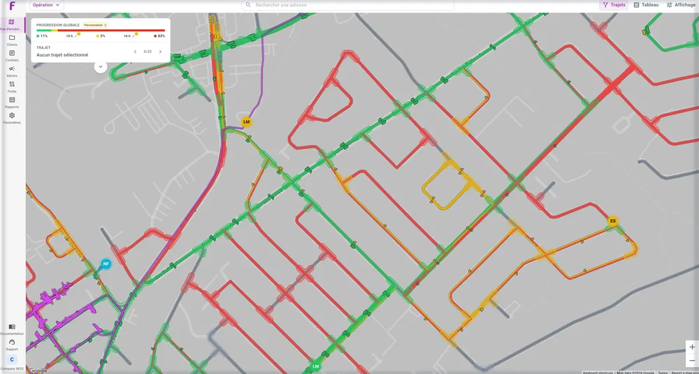 Flokon map view displaying a street network overlaid with green, red, yellow, and purple route-status lines.