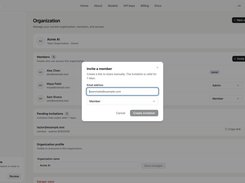 Jectora Organization page with an Invite a member modal containing an email field and role selector.