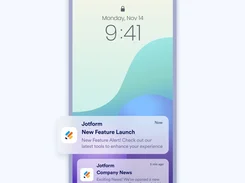 Phone lock screen displaying Jotform new-feature and company-news push notifications.