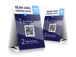 Two Kayana tabletop signs instruct customers to scan a QR code and order and pay using their phone.