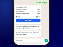 Mobile chat ordering interface showing an itemized food order, a £29.00 payment button, and order-status messages.