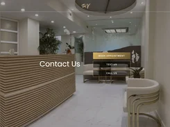 Contact page over a photograph of a clinic reception area, with buttons to book an appointment, text, or call.