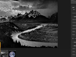Dark photo-editing interface showing a black-and-white mountain and river photograph with Light adjustment sliders and image thumbnails.