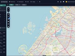 Live map of Dubai with Arabic street names, customer pins from Jumeirah to Mirdif, and a side list of eight online drivers such as Anwar Hossain and Bilal Raza with their Toyota vans.