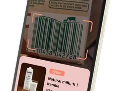 Angled smartphone display showing a Scan interface recognizing a milk carton barcode and a result card for “Natural milk, 1l | itambe,” marked “Bad,” with “4/23 ingredients are not suitable for you” and a “View details” button.