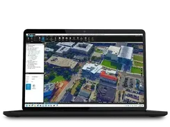 PhotoMesh desktop interface displaying a textured 3D city model.