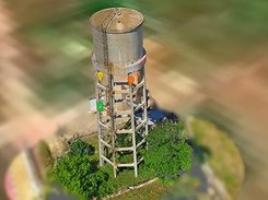 Textured 3D reconstruction of a water tower with colored location markers.