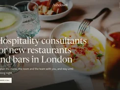 Restaurant website homepage for Ashdown with a dining-table hero image, navigation, and an “Arrange a call” button.