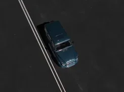 Overhead finished render of a dark SUV on a marked road.