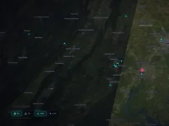 RemoteView satellite-style map of the Washington, DC region with city labels, cyan aircraft markers, a pink location pin, and map controls.
