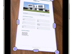 Scantivo iPhone Adjust framing screen with draggable corner and edge handles around a photographed property document.