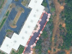 Mobile SurfaceMeasure interface showing a parking lot outlined on satellite imagery, a 21,625 sq ft result, and a View quote control.