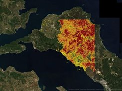 Satellite map of a coastal area with a rectangular red, orange, and yellow raster analysis overlay.