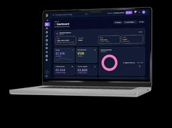 WrkGenie desktop dashboard displayed on a laptop, with operational summary cards, revenue figures, and a service-revenue donut chart.