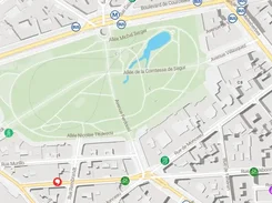 Map interface centered on a large park with a blue location pin, transit markers, cycling markers, and labeled surrounding streets.